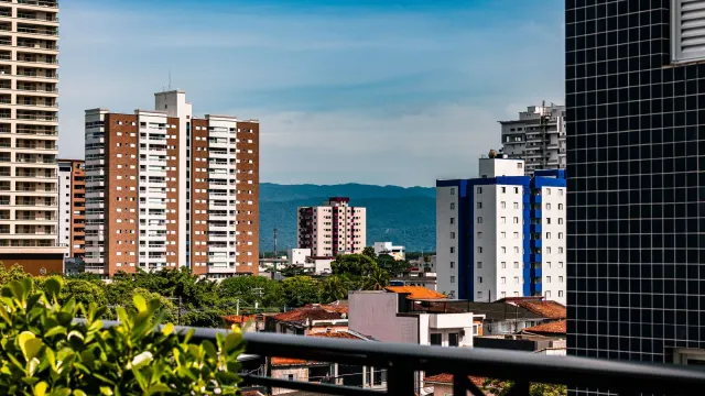Beautiful urban skyline featuring high-rise buildings against a clear blue sky.